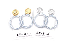 Load image into Gallery viewer, Blue Cutout Circle White Print Dangles